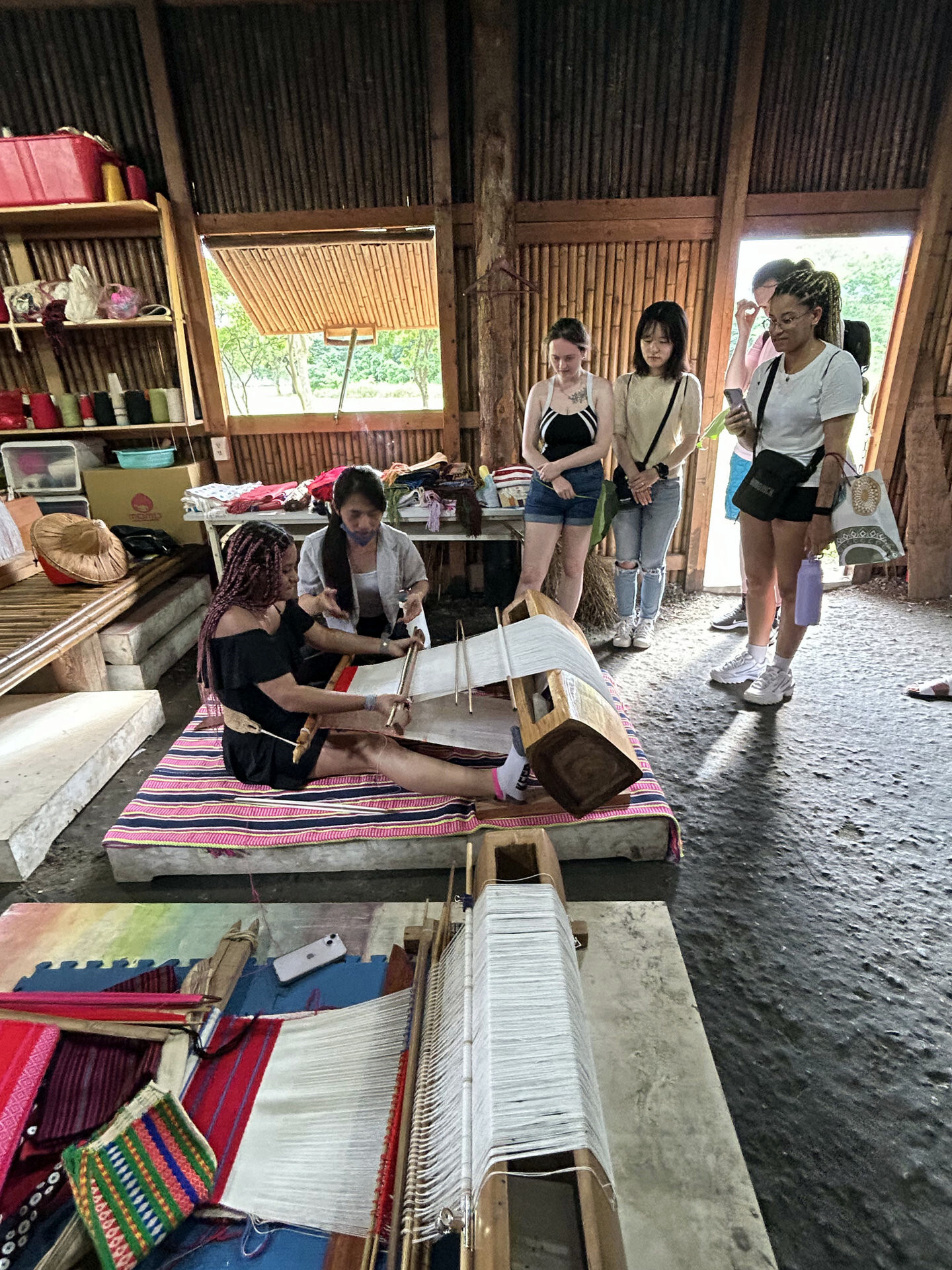The University of Central Lancashire guests experienced the traditional Indigenous weaving techniques in a bamboo and hemp house