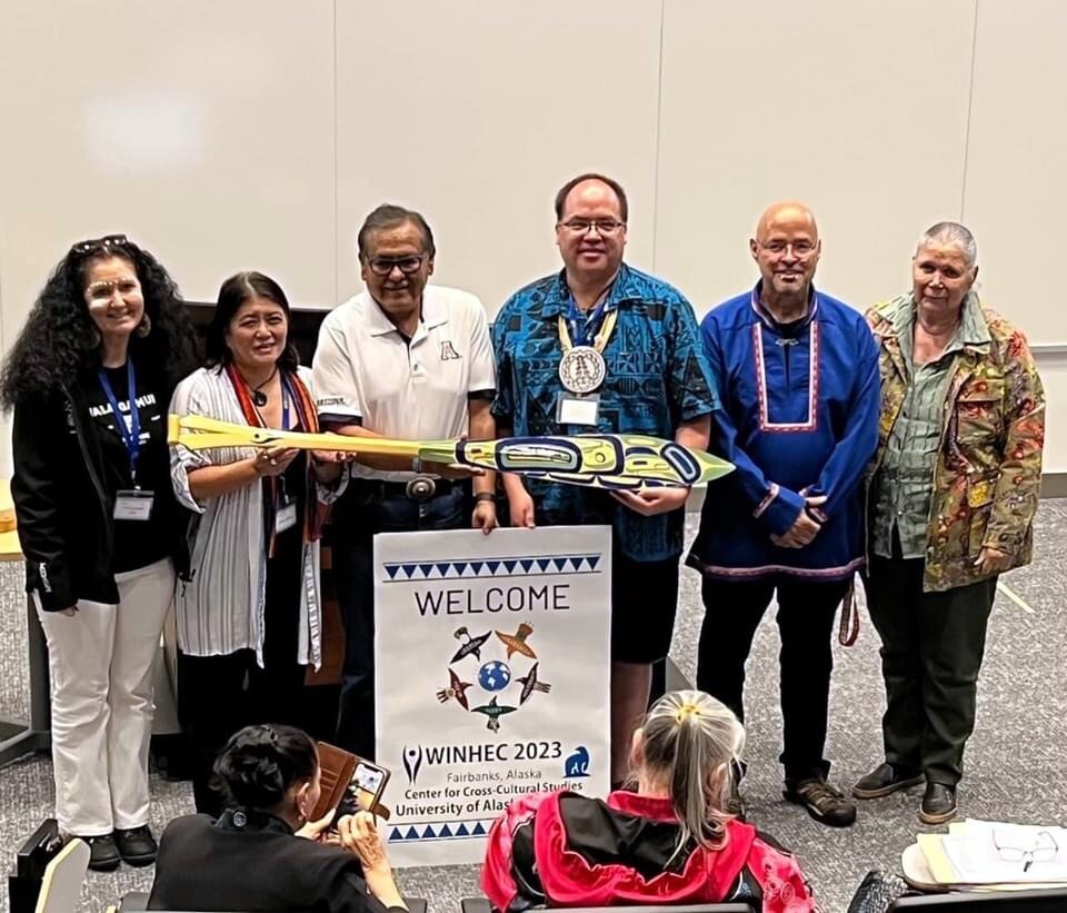 WINHEC co-chairs Dr.Bavaragh Dagalomai and Dr. Elmer Guy (second and third from the left) and the Executive Committee (2019-2023) took Photo with WINHEC Paddle during Aalaska AGM